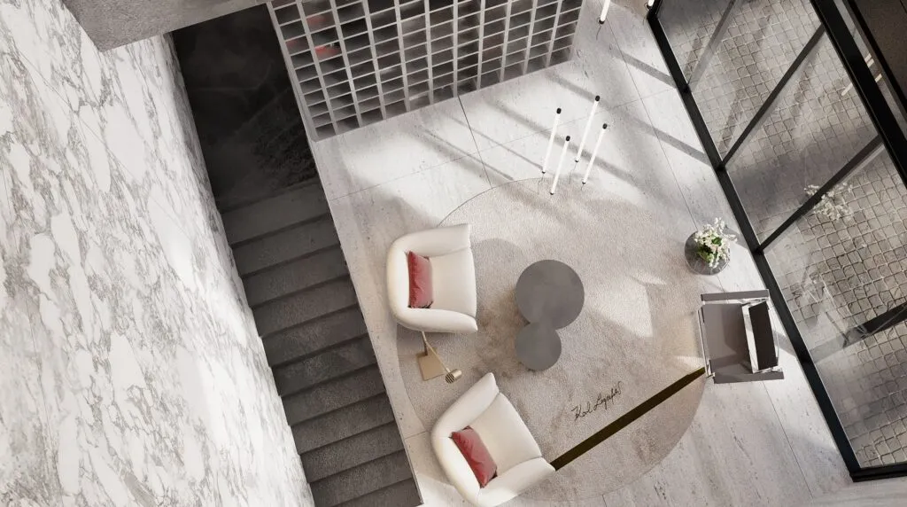 Vista cenital de un espacio interior de Karl Lagerfeld Residences en Bosque Real, con escaleras, mobiliario contemporáneo y acabados de mármol.